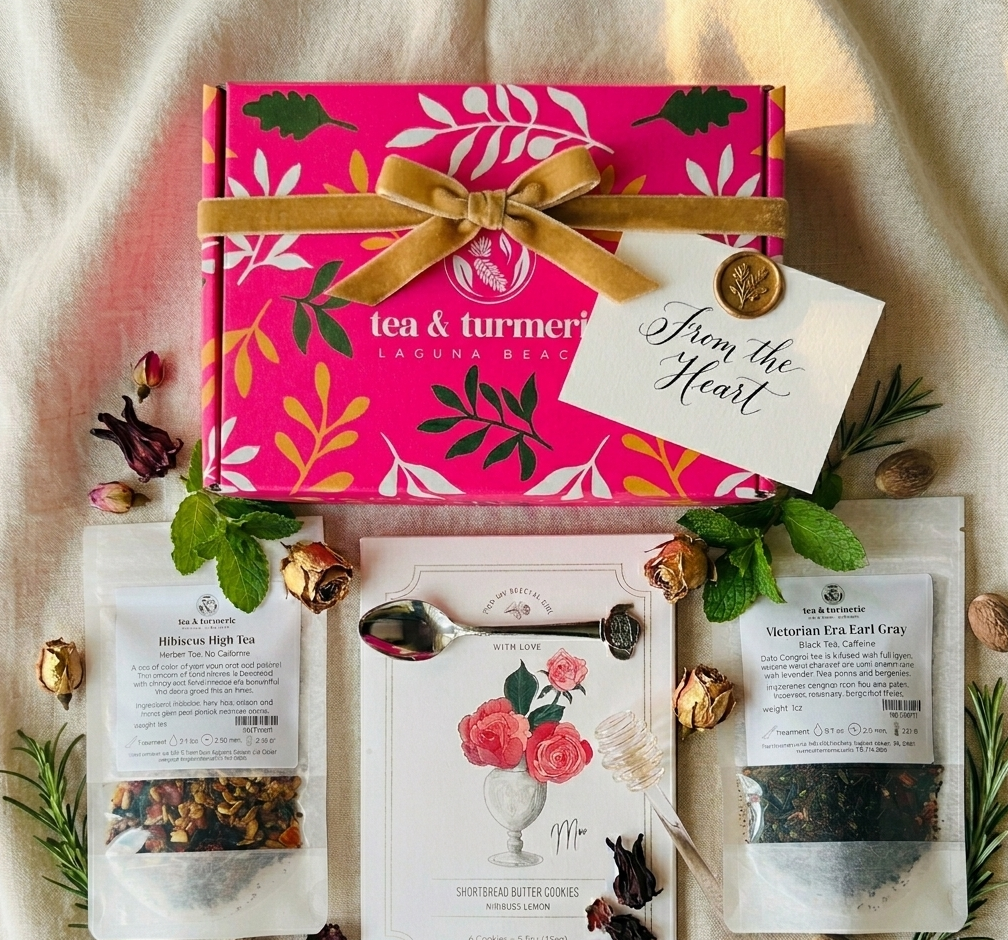 Mother's Day tea gift box from Tea and Turmeric Laguna Beach with Hibiscus High Tea, Victorian Era Earl Gray, tea spoon, floral card and shortbread cookies on a cream linen background