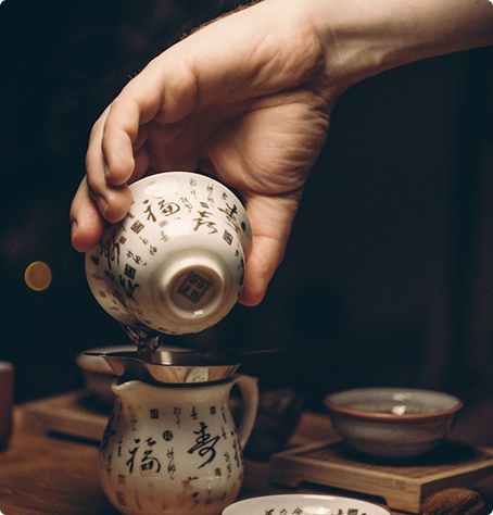 Pouring tea into a strainer